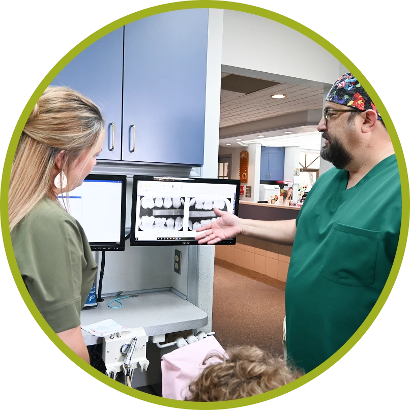 Dr. Cantu reviewing x-rays with team member